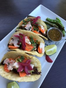 Short Rib Tacos: Slow braised short ribs with pickled red onions and carrots, silantro. With a spicy salsa and roasted shishito peppers. 