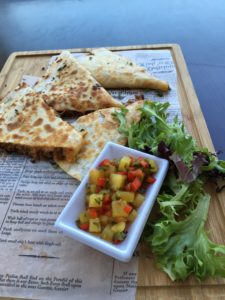 Wild Boar Quesadilla: Slow cooked and shredded wild boar, gouda and mozzarella cheese, with a pineapple habanero salsa. 