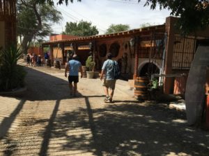 Pisco Village in Ica, Jeff and Luis walking down the main street