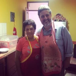 Maria is showing Jeff how to cook some of Peru's traditional dishes