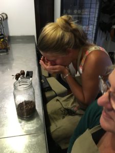 Claudia smelling the cocoa beans