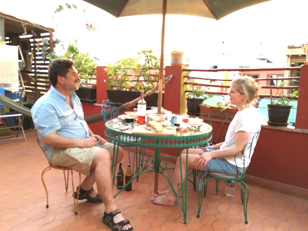 Jeff and Joeri, a sweet Dutch girl we meet at the Airbnb enjoying a picnic meal on the rooftop patio